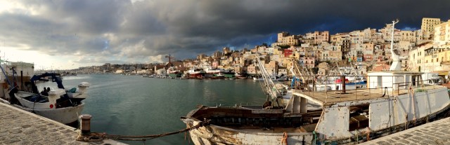 Dark afternoon - fishing boats return to Sciacca.port 
